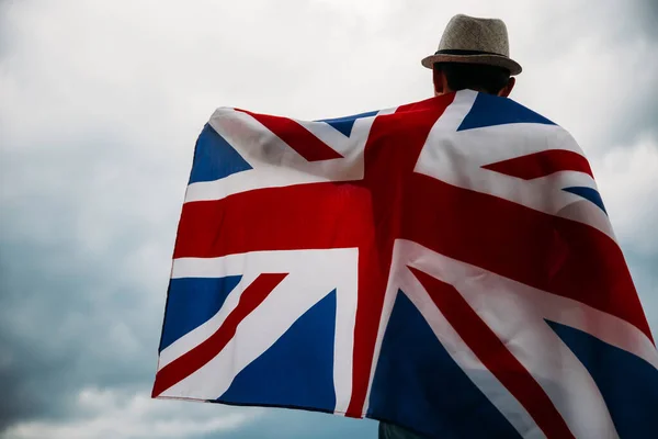 Man holding UK Flag